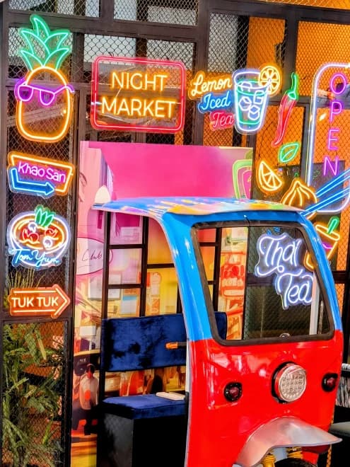 Hand-bent neon signs - Night Market, Khao San, Tom Yum, Tuk Tuk - above the tuk-tuk booth